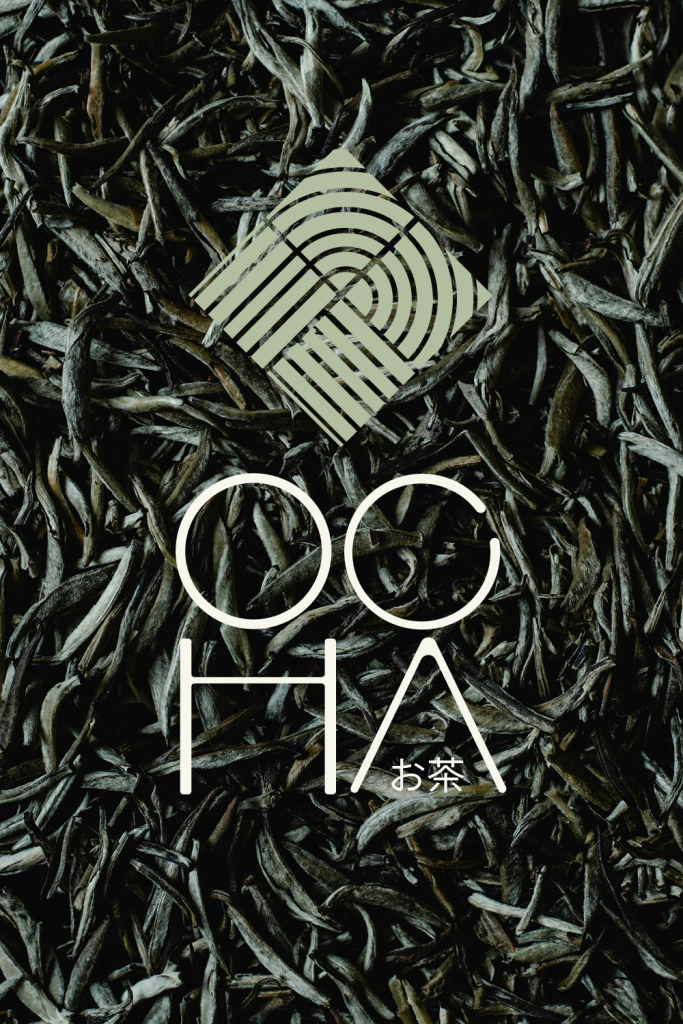 A close up photograph of dried loose leaf tea with the Ocha logo overlaid.